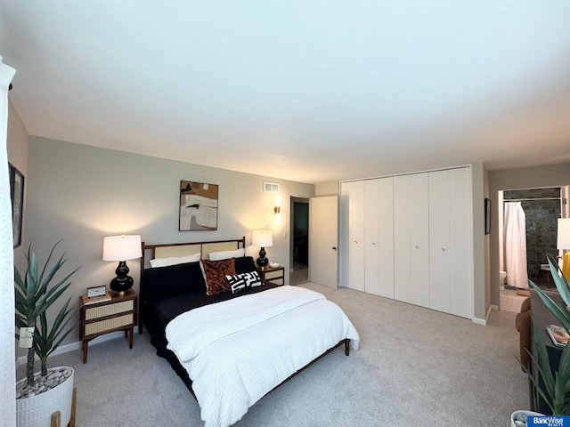 5941 Margo Dr, Lincoln, NE 68510 - bedroom featuring light colored carpet, a closet, and ensuite bath