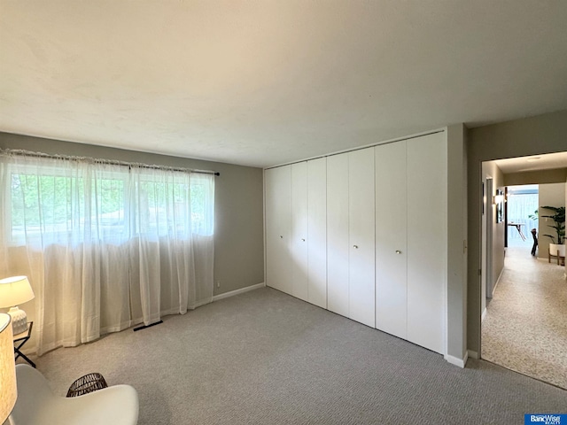 5941 Margo Dr, Lincoln, NE 68510 - unfurnished bedroom featuring carpet floors, baseboards, and a closet