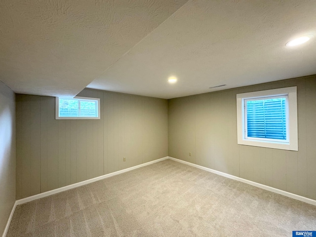 5941 Margo Dr, Lincoln, NE 68510 - basement featuring carpet flooring, baseboards, a textured ceiling, and recessed lighting