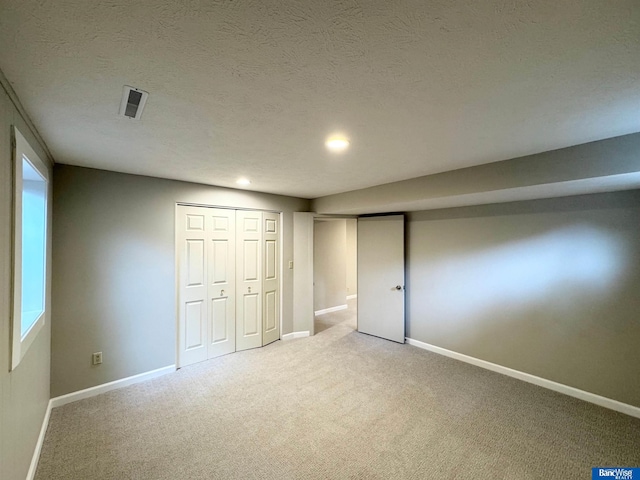 5941 Margo Dr, Lincoln, NE 68510 - unfurnished bedroom with carpet flooring, baseboards, recessed lighting, and a textured ceiling