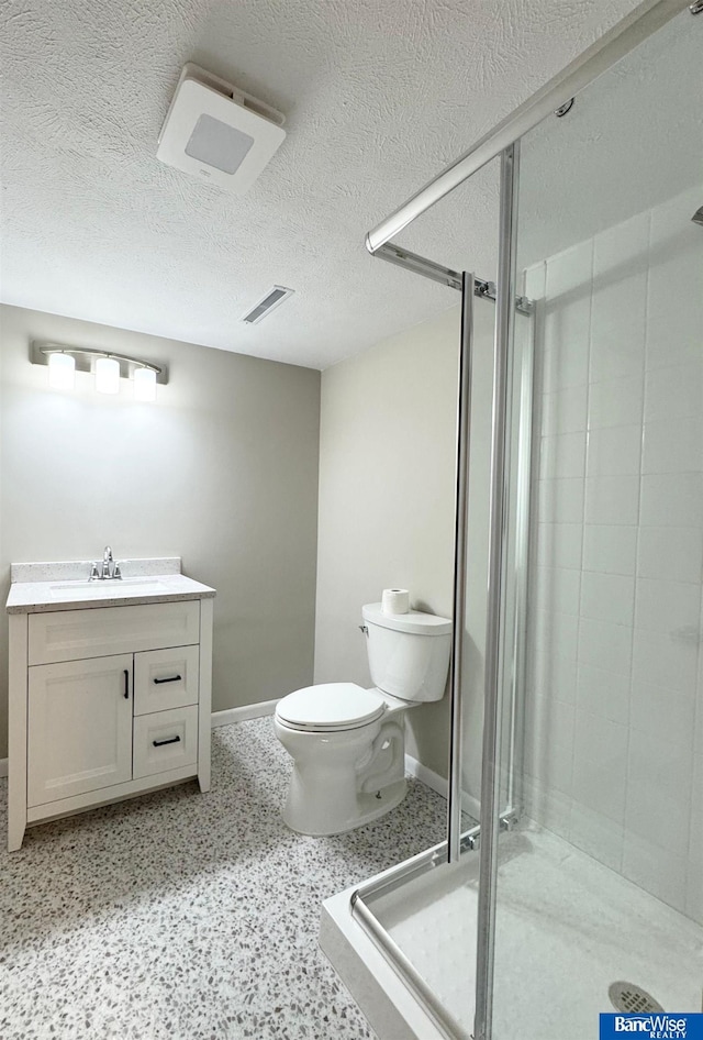 5941 Margo Dr, Lincoln, NE 68510 - full bath featuring toilet, a stall shower, vanity, baseboards, and a textured ceiling