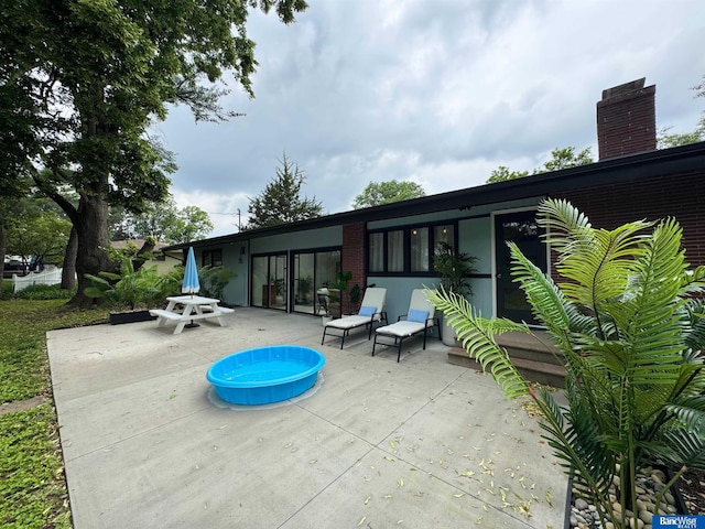 5941 Margo Dr, Lincoln, NE 68510 - view of patio with a pool