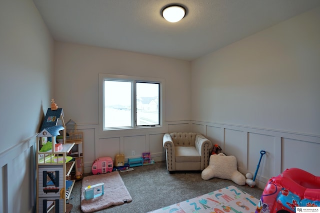 11602 S 116th St, Papillion, NE 68046 - game room featuring carpet floors, a decorative wall, and wainscoting