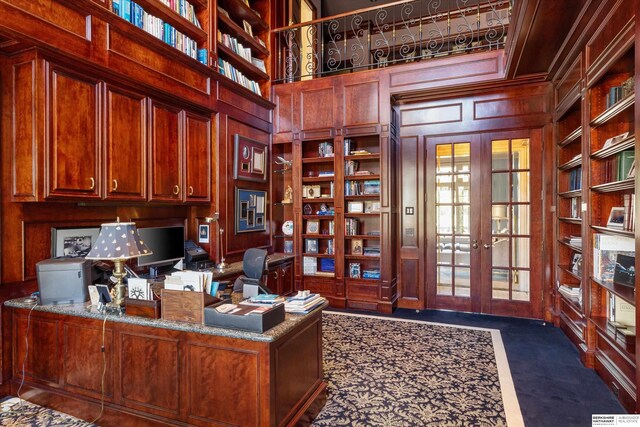 1215 N 136th St, Omaha, NE 68154 - office featuring built in features, french doors, wood walls, a decorative wall, and a towering ceiling