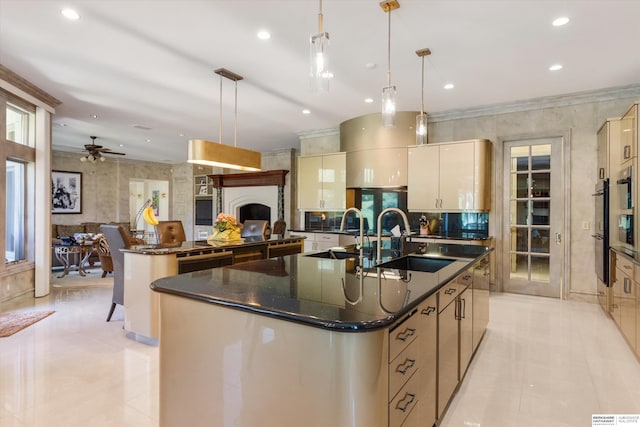 1215 N 136th St, Omaha, NE 68154 - kitchen with a large island with sink, a sink, light tile patterned floors, cream cabinets, and ceiling fan