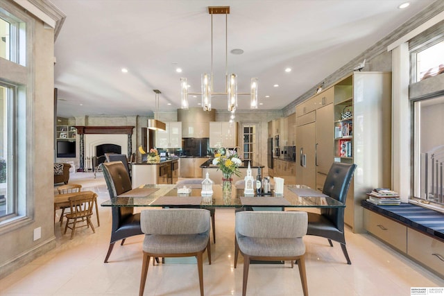 1215 N 136th St, Omaha, NE 68154 - dining space featuring light tile patterned floors, a chandelier, recessed lighting, and a premium fireplace
