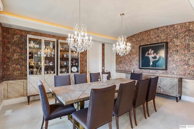 1215 N 136th St, Omaha, NE 68154 - dining area featuring a chandelier, wallpapered walls, a wainscoted wall, and a decorative wall