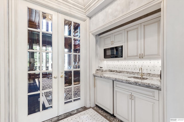 1215 N 136th St, Omaha, NE 68154 - indoor wet bar featuring black microwave and french doors