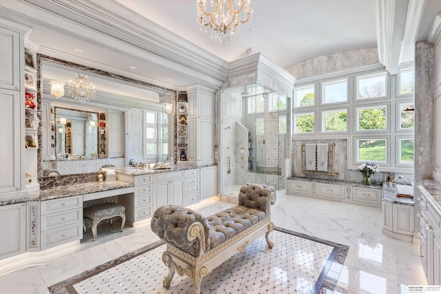 1215 N 136th St, Omaha, NE 68154 - full bath featuring marble tiled floors, a chandelier, a walk in shower, lofted ceiling, and crown molding