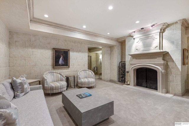 1215 N 136th St, Omaha, NE 68154 - living area with crown molding, tile walls, carpet, a fireplace, and recessed lighting