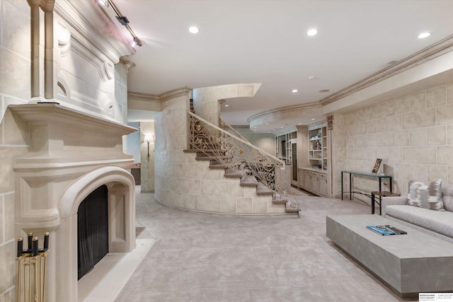 1215 N 136th St, Omaha, NE 68154 - carpeted living room featuring crown molding, stairs, recessed lighting, and tile walls