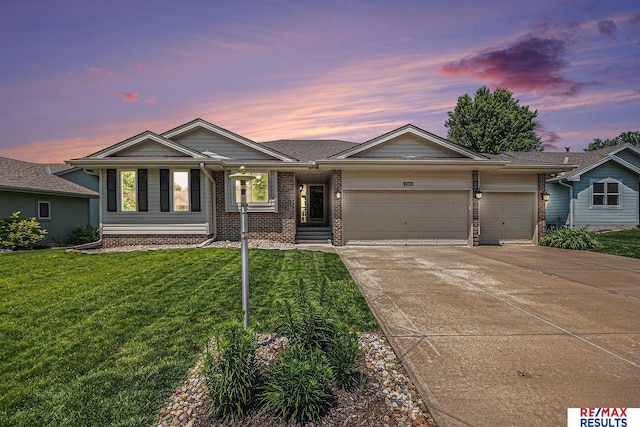 21808 Hilltop Ave, Gretna, NE 68028 - single story home with a garage, concrete driveway, a lawn, and brick siding