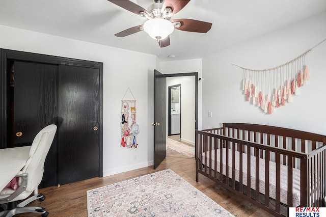 21808 Hilltop Ave, Gretna, NE 68028 - bedroom featuring wood finished floors, a desk, a crib, and ceiling fan
