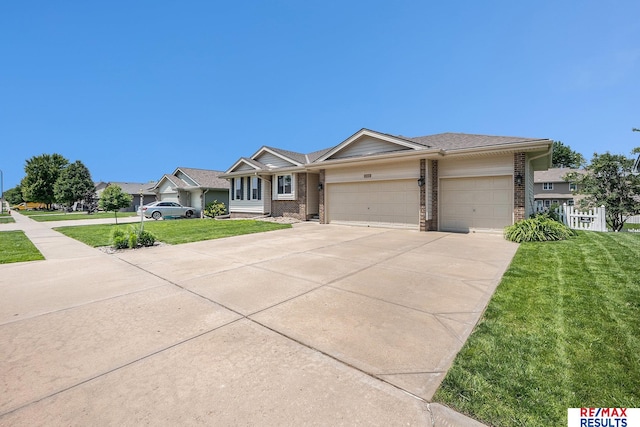 21808 Hilltop Ave, Gretna, NE 68028 - view of front of home with a front yard, a garage, concrete driveway, and brick siding
