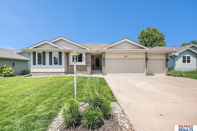 21808 Hilltop Ave, Gretna, NE 68028 - ranch-style home with an attached garage, brick siding, driveway, and a front lawn