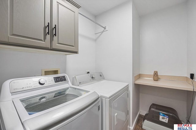 21808 Hilltop Ave, Gretna, NE 68028 - laundry area featuring washer and dryer, cabinet space, and wood finished floors