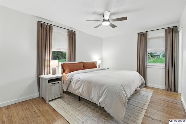 6236 Poppleton Ave, Omaha, NE 68106 - bedroom featuring baseboards, light wood finished floors, and a ceiling fan