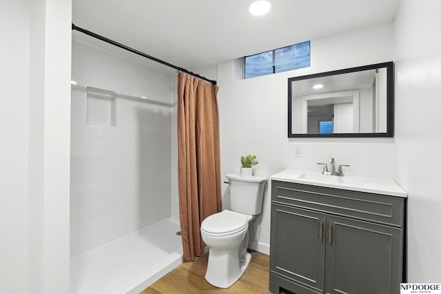 6236 Poppleton Ave, Omaha, NE 68106 - full bathroom with toilet, vanity, a shower with curtain, wood finished floors, and recessed lighting