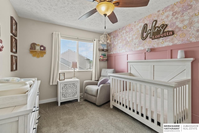 16325 Erskine St, Omaha, NE 68116 - bedroom with a nursery area, carpet floors, a textured ceiling, a ceiling fan, and wainscoting