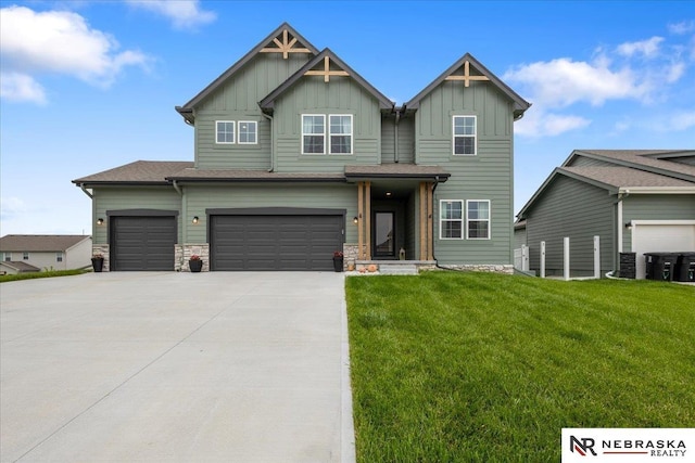 9601 S 184th Ter, Omaha, NE 68136 - craftsman-style house featuring board and batten siding, a front yard, concrete driveway, and an attached garage