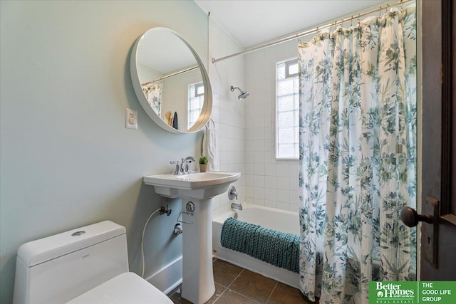 816 S 49th St, Omaha, NE 68106 - bathroom with shower / bath combination with curtain, toilet, and tile patterned flooring