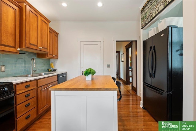 816 S 49th St, Omaha, NE 68106 - kitchen featuring freestanding refrigerator, a sink, butcher block counters, backsplash, and dark wood-style floors