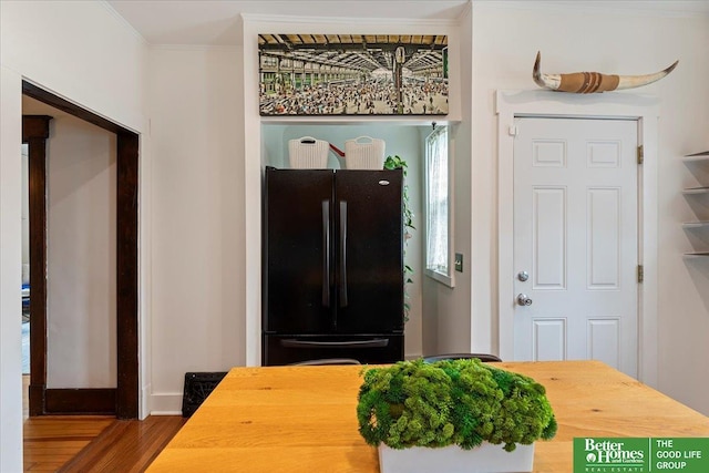 816 S 49th St, Omaha, NE 68106 - entryway featuring wood finished floors, crown molding, and baseboards