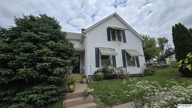 15410 Bennington Rd, Bennington, NE 68007 - view of front facade with a front yard