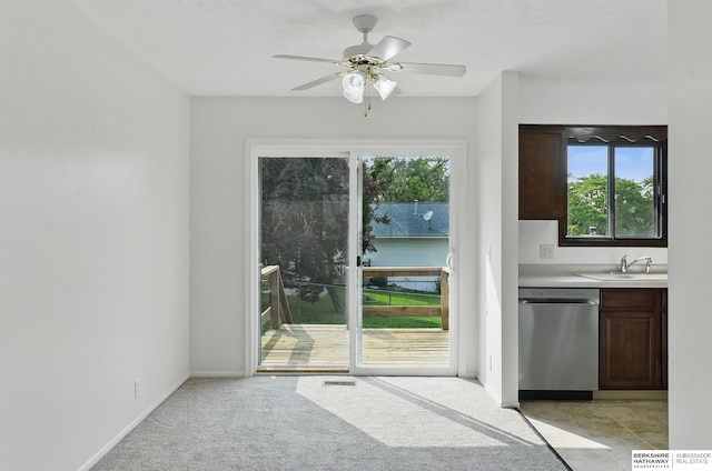 13304 S 21st St, Bellevue, NE 68123 - doorway to outside with a ceiling fan and light colored carpet