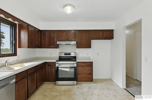 13304 S 21st St, Bellevue, NE 68123 - kitchen featuring appliances with stainless steel finishes, range hood, and light countertops
