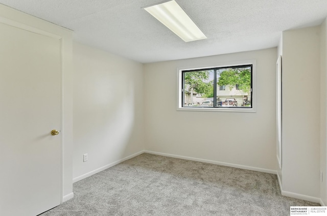 13304 S 21st St, Bellevue, NE 68123 - carpeted spare room featuring baseboards and a textured ceiling