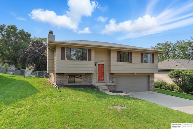 13304 S 21st St, Bellevue, NE 68123 - raised ranch with a chimney, a garage, and driveway