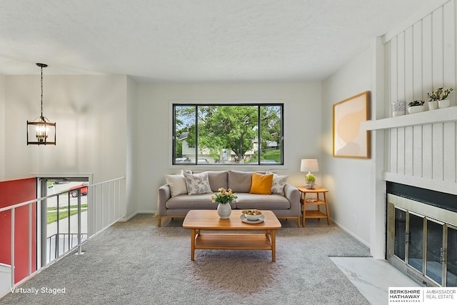13304 S 21st St, Bellevue, NE 68123 - living room with a chandelier, carpet, a fireplace with flush hearth, and a textured ceiling