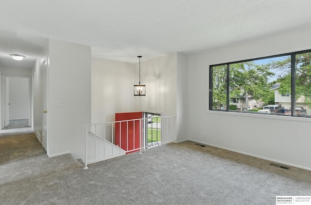 13304 S 21st St, Bellevue, NE 68123 - spare room with carpet floors and a chandelier