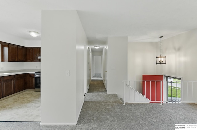13304 S 21st St, Bellevue, NE 68123 - corridor with an upstairs landing, a chandelier, and light colored carpet
