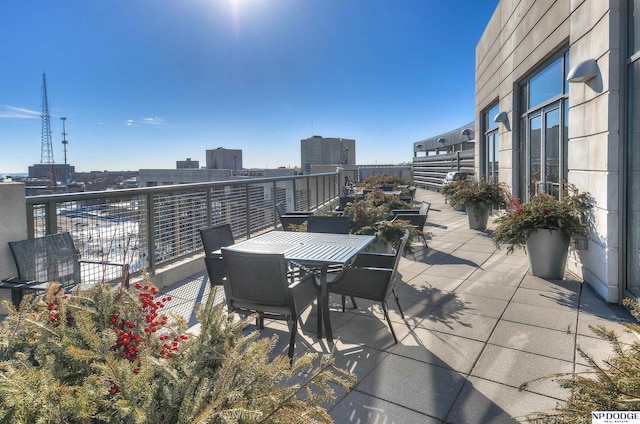 3200 Farnam Ct Unit 3604, Omaha, NE 68131 - view of patio featuring a balcony and outdoor dining space
