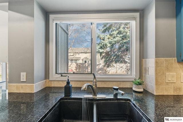 716 N 148th St, Omaha, NE 68154 - kitchen view of a sink and dark stone countertops