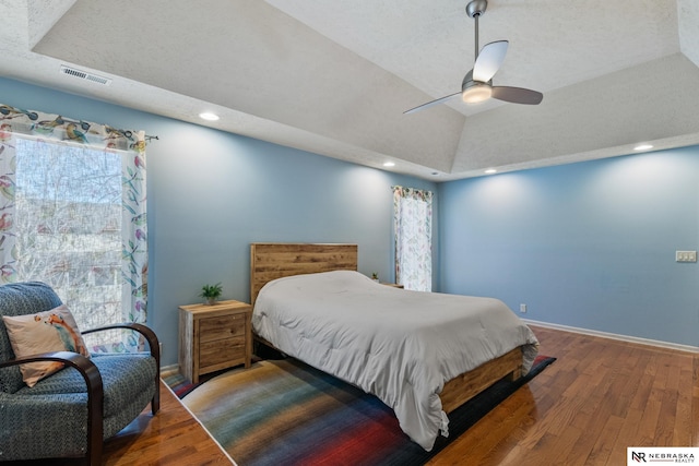 716 N 148th St, Omaha, NE 68154 - bedroom featuring wood finished floors, baseboards, recessed lighting, ceiling fan, and a raised ceiling