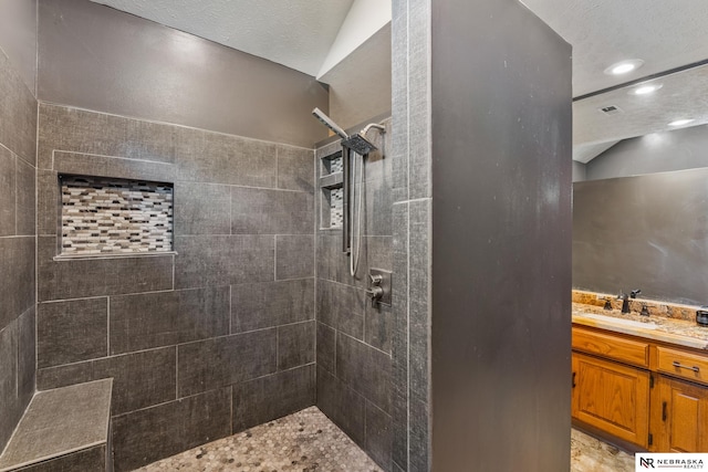 716 N 148th St, Omaha, NE 68154 - bathroom featuring a tile shower, vanity, and recessed lighting