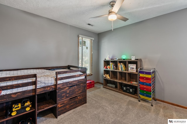 716 N 148th St, Omaha, NE 68154 - bedroom featuring carpet flooring, baseboards, a textured ceiling, and ceiling fan