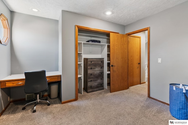 716 N 148th St, Omaha, NE 68154 - home office featuring carpet floors, a textured ceiling, and baseboards