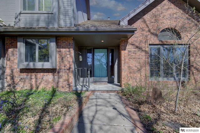716 N 148th St, Omaha, NE 68154 - doorway to property featuring brick siding