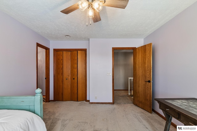 716 N 148th St, Omaha, NE 68154 - bedroom featuring carpet flooring, a textured ceiling, a closet, baseboards, and ceiling fan