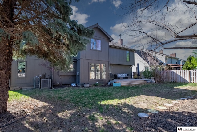 716 N 148th St, Omaha, NE 68154 - rear view of property with a chimney, a wooden deck, and an outdoor living space