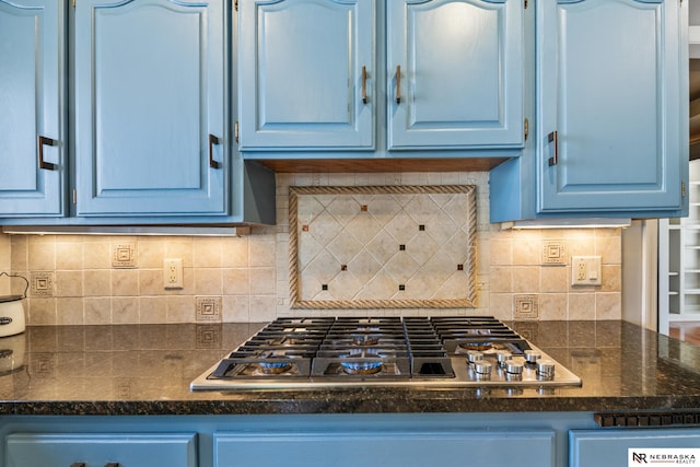 716 N 148th St, Omaha, NE 68154 - kitchen with stainless steel gas cooktop, blue cabinetry, dark countertops, and tasteful backsplash