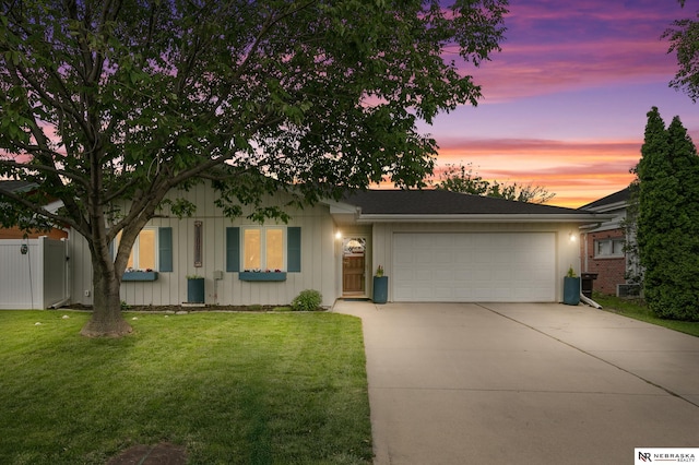 112 W Lakeshore Dr, Lincoln, NE 68528 - ranch-style house featuring a garage, concrete driveway, and board and batten siding