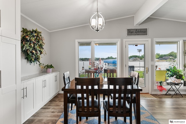 112 W Lakeshore Dr, Lincoln, NE 68528 - dining room with wood finished floors, a chandelier, a water view, and crown molding