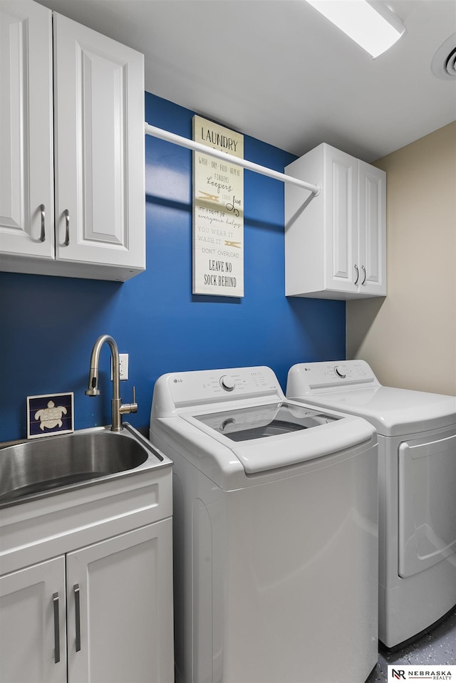 112 W Lakeshore Dr, Lincoln, NE 68528 - laundry area with washing machine and dryer and cabinet space