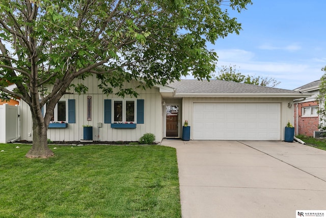 112 W Lakeshore Dr, Lincoln, NE 68528 - single story home with an attached garage, driveway, a front yard, board and batten siding, and a shingled roof