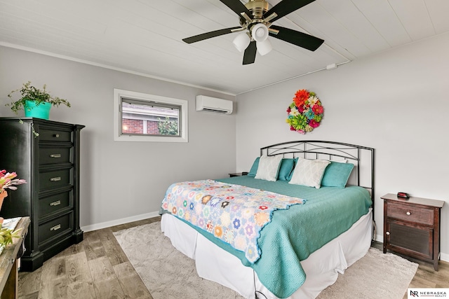 112 W Lakeshore Dr, Lincoln, NE 68528 - bedroom featuring a wall mounted air conditioner, light wood-type flooring, baseboards, ceiling fan, and wooden ceiling